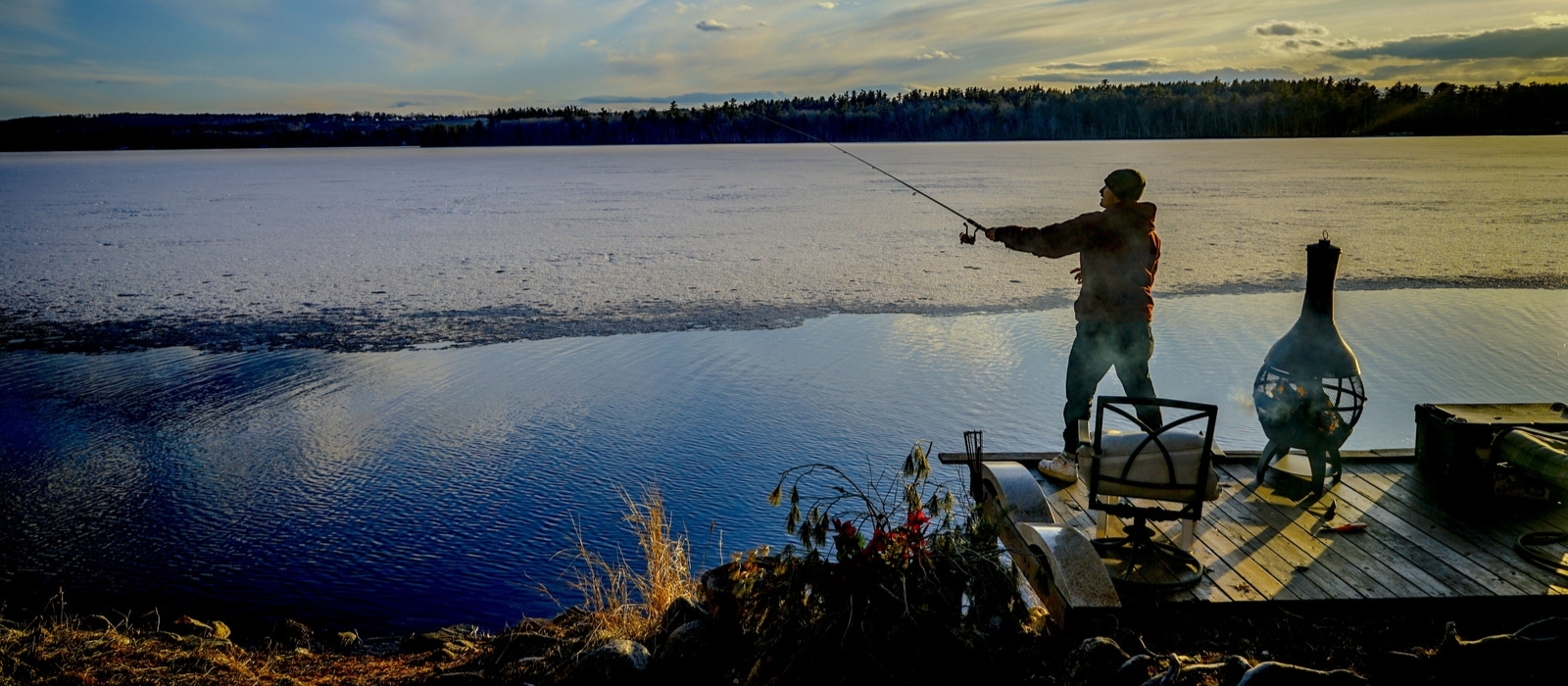 a man fishing in lake harmony